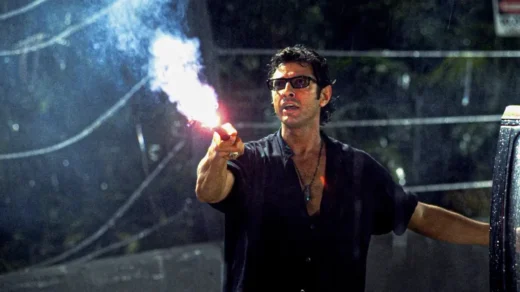 Ian Malcolm segurando um flare em Jurassic Park