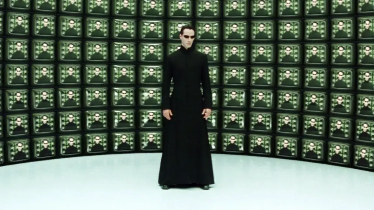 Por que Bilionários Querem que Você Acredite que Vive numa Simulação 1 Cena de Matrix Reloaded (2003) representando a hipótese da simulação e o controle sistêmico.
